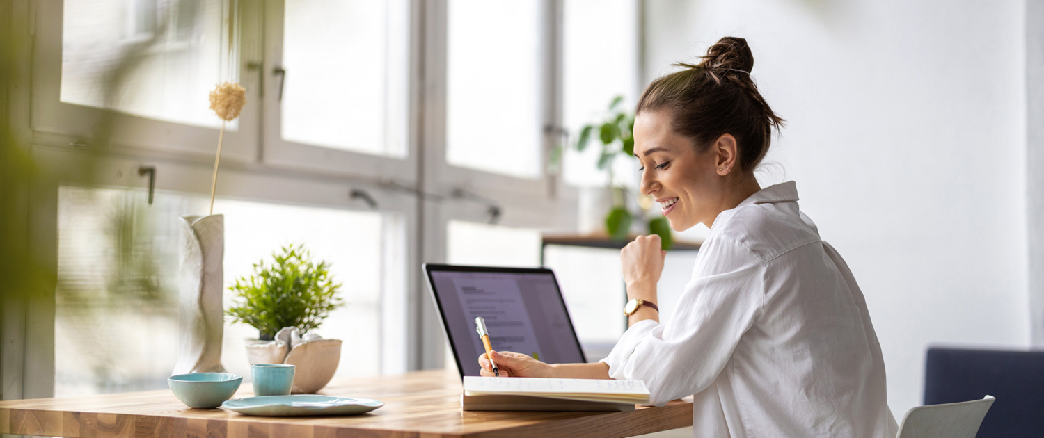 Creative Young Woman Working On Laptop In Her Studio
