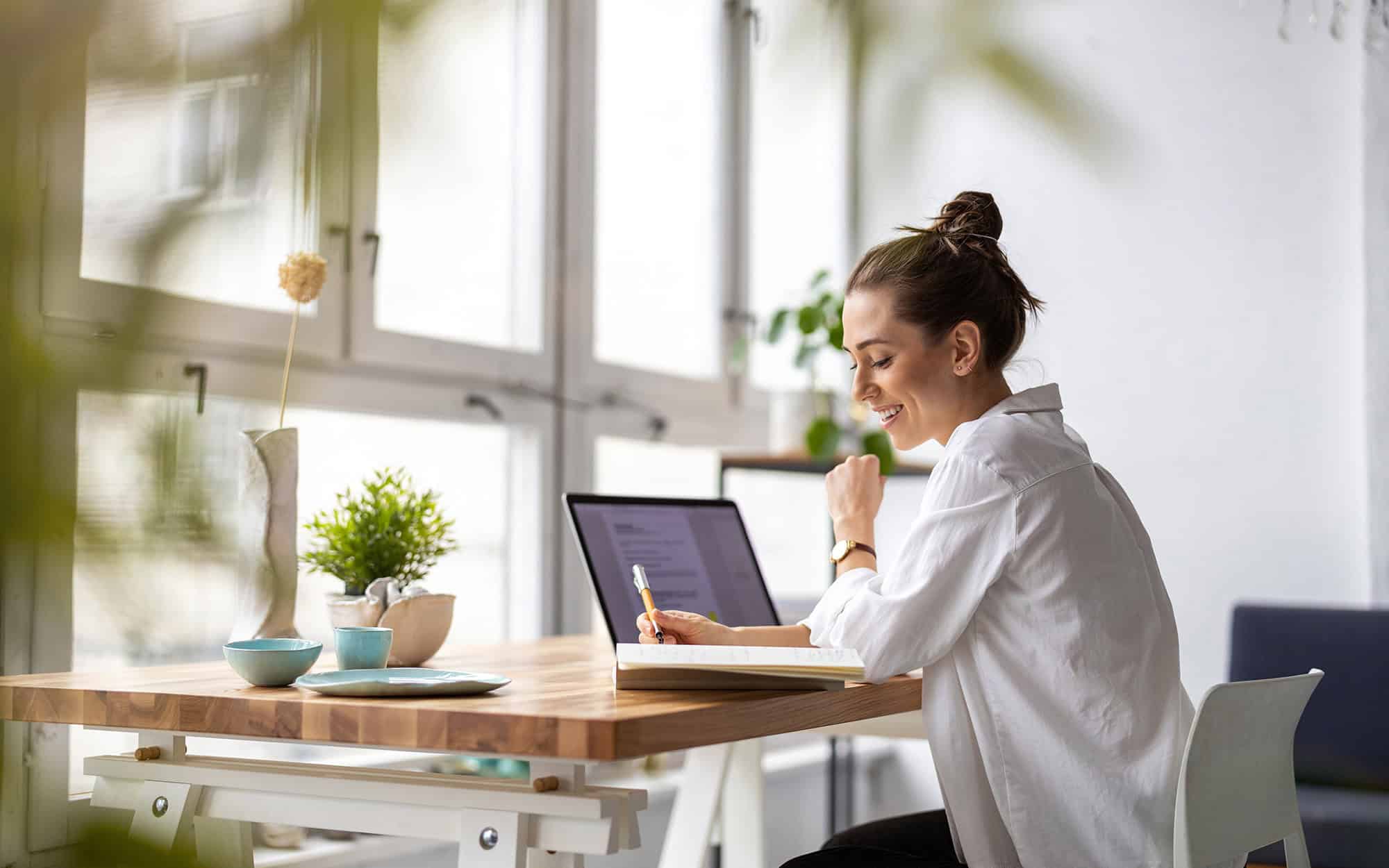 Creative Young Woman Working On Laptop In Her Studio