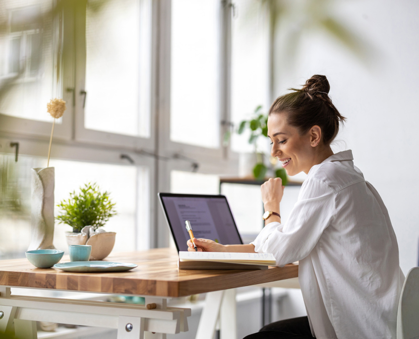 Creative Young Woman Working On Laptop In Her Studio