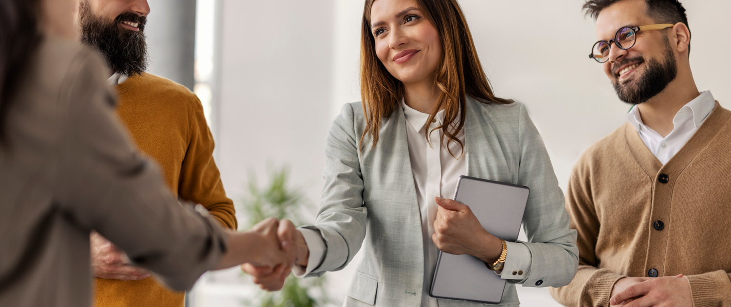 Female Chief Shaking Hands With Business Partner