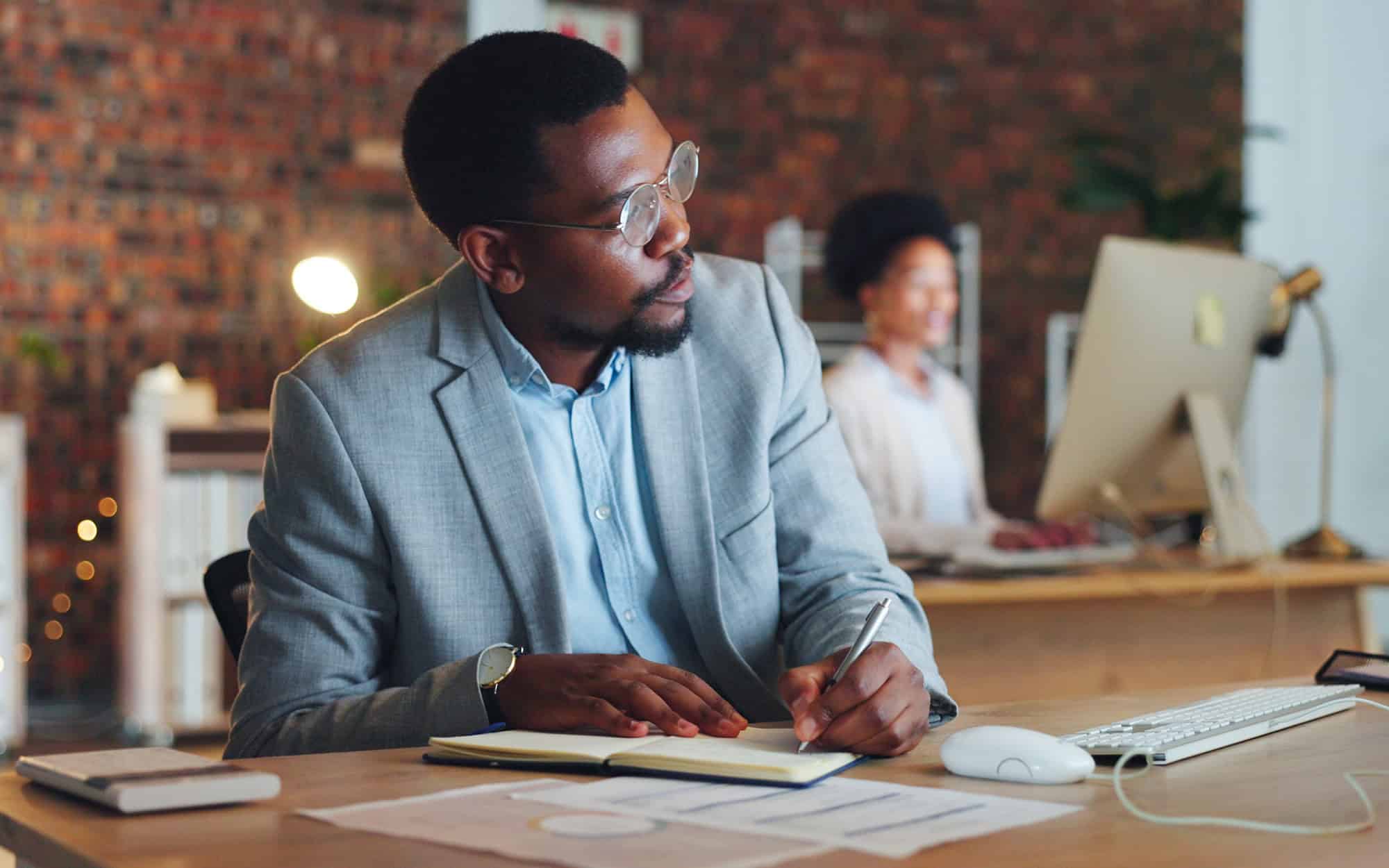 Planning, Black Man And Writing Notes In Office With Business Agenda