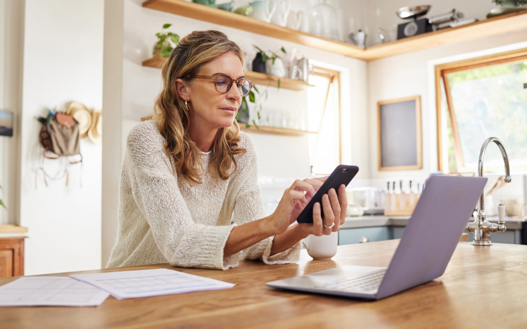 Person Doing Taxes At Laptop